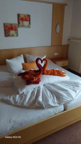 a bed with two snakes sitting on top of it at Haus Alpina in Kaunertal
