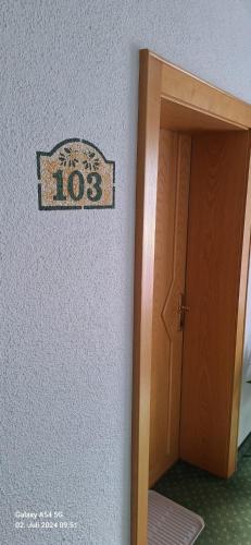 a sign on a wall next to a door at Haus Alpina in Kaunertal