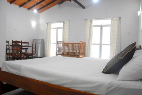 Postel nebo postele na pokoji v ubytování Insa Guest House Kandy