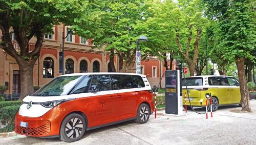 a red and white car parked at a hydrogen fueling station at Interno Marche Design Experience Hotel in Tolentino
