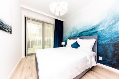 Ένα ή περισσότερα κρεβάτια σε δωμάτιο στο NZ REZYDENCJA NIECHORZE Apartament z ogródkiem przy plaży