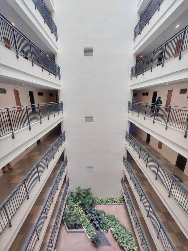 a view of the inside of a building at Modern 1-Bedroom Condo at Matina Enclaves Residence, Close to SM City Davao in Davao City