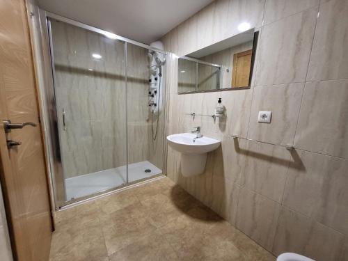 a bathroom with a shower and a sink and a toilet at CASA D´PEPE in Meis