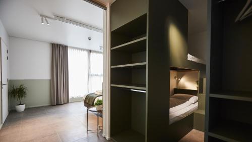 Ein Bett oder Betten in einem Zimmer der Unterkunft Vakantiewoning Het Kasterhuis