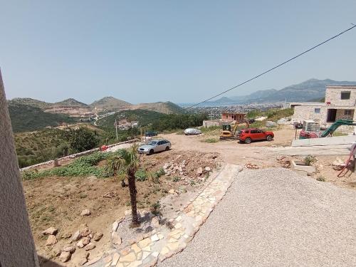 a view of a street with cars parked on a hill at Apartmani Kasa in Rap
