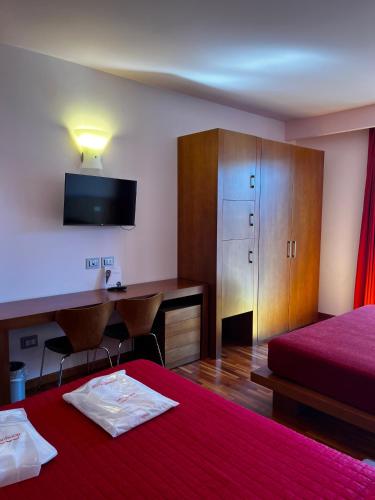 Postel nebo postele na pokoji v ubytování don guglielmo panoramic hotel & spa