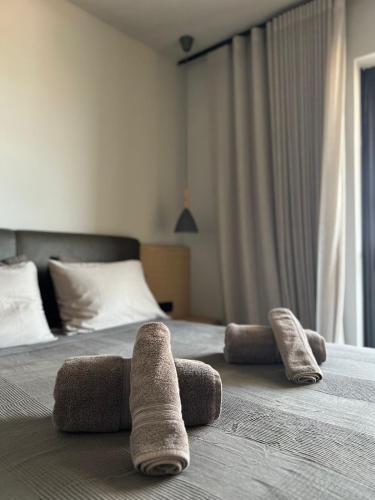Ένα ή περισσότερα κρεβάτια σε δωμάτιο στο Varkiza Cozy Seaside Apartment