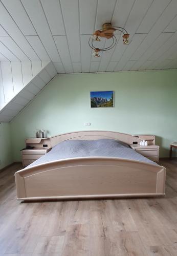 a bedroom with a large bed in a room at Ferienwohnung Am Gillrather Hof in Geilenkirchen