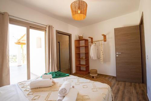 Postel nebo postele na pokoji v ubytování Villa MAJU