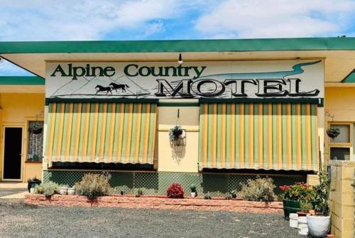 an alice county morrill building with a sign on it at ALPINE COUNTRY MOTEL plus FREE COFFEE in Cooma