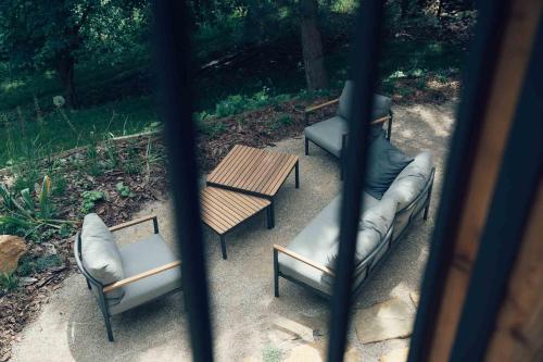 a view of a patio with chairs and a table at Chata Lipinka in Strážnice