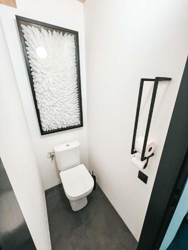 a small bathroom with a toilet and a window at Chata Lipinka in Strážnice