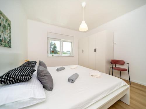 Postel nebo postele na pokoji v ubytování Laganini apartman Rab