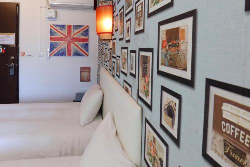 Postel nebo postele na pokoji v ubytování Love River Inn 愛河日央