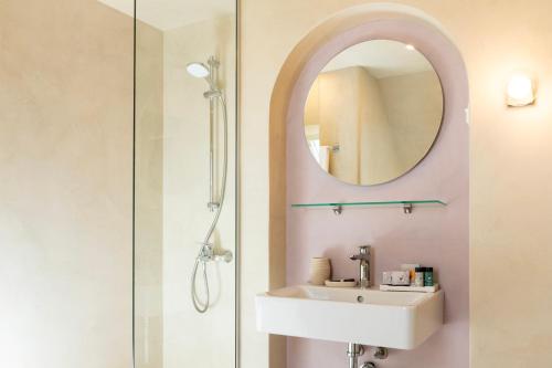 a bathroom with a sink and a mirror at St. George Hotel in Sofia