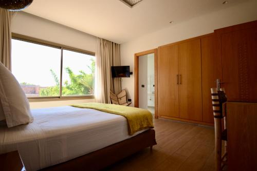 Postel nebo postele na pokoji v ubytování Villa MAÙRA Marrakech