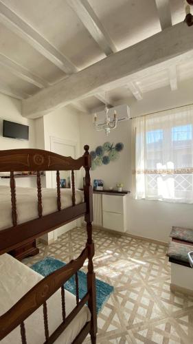a bedroom with a bunk bed and a window at - La Casa di Rosi- Versilia & Free Parking- in Camaiore