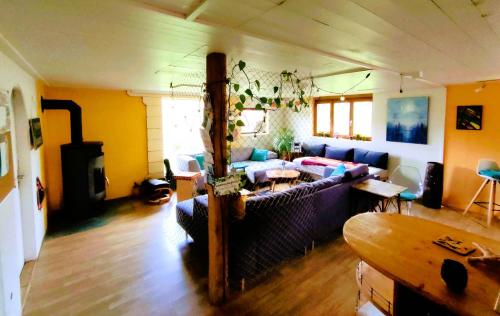 a living room with a couch and a table at Nisihof, Abendblick in Oberkirch