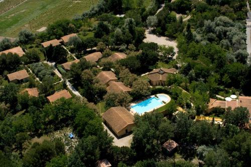 an aerial view of a house with a swimming pool at Le Mas Des Sables in Aigues-Mortes