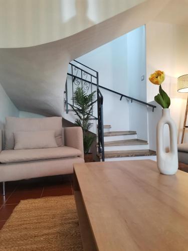 a living room with a couch and a table at Casa Sofia in Putzu Idu