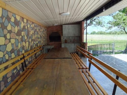 an empty room with benches and a wall of windows at Rancho Stepanavan in Maksim Gorʼkiy