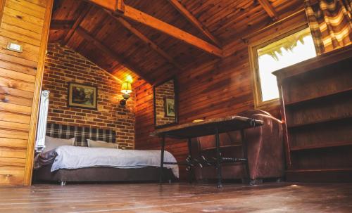 a bedroom with a bed and a piano in a room at Dar Zaghouan in Zaghouan