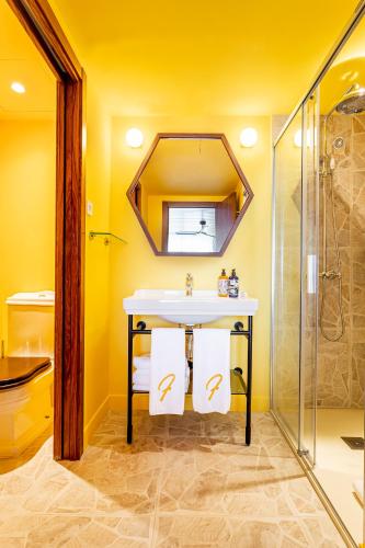 a bathroom with a sink and a shower at Los Felices Ibiza in San Antonio Bay