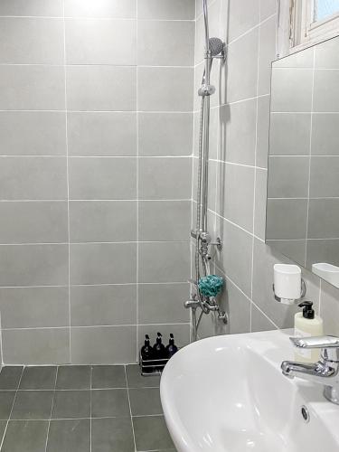 a bathroom with a sink and a shower at Sodam Haengoong in Suwon