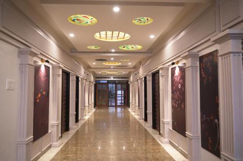 a corridor of a building with a ceiling at The Piku's in Digha