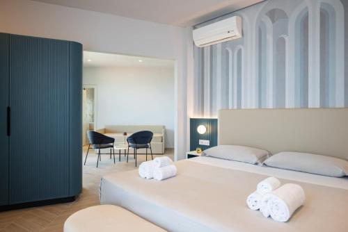 Postel nebo postele na pokoji v ubytování Hotel Playa Suite