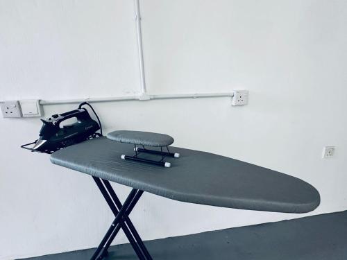 a ping pong table in the corner of a room at Kuu Inn Hotel in Arau