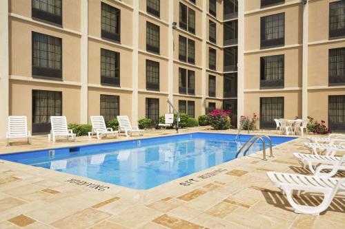 a swimming pool in front of a building at Days Inn by Wyndham Rome Downtown in Rome