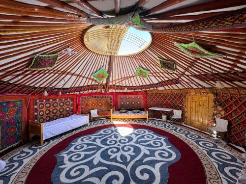 an interior of a yurt with a large room at Ulgii Ger Camp in Ölgiy