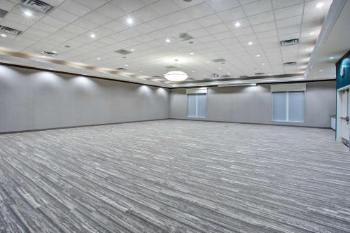 a large room with a large room with a large floor at Hilton Garden Inn Benton Harbor in Benton Harbor