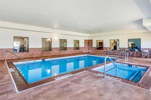 a large swimming pool with blue water at Comfort Suites Merrillville near US 30 in Merrillville