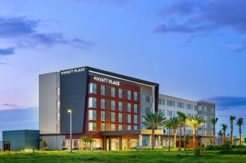 a rendering of a building with palm trees in front at Hyatt Place Melbourne Airport, Fl in Melbourne