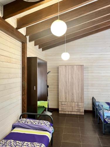 a room with two beds and a wooden ceiling at Blesamemucho - Casa Rural Situada en BLESA in Blesa