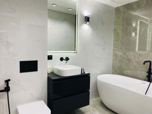 Ένα μπάνιο στο Apartament Relax Chișinău