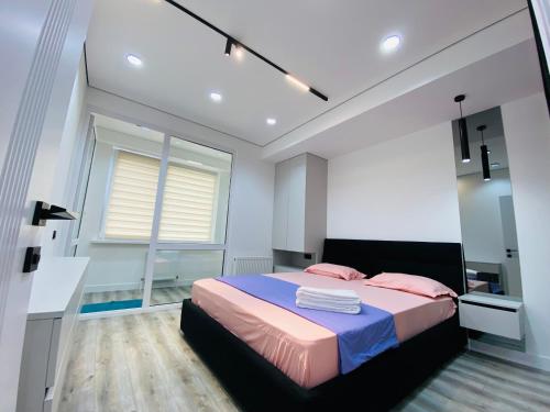 Ένα ή περισσότερα κρεβάτια σε δωμάτιο στο Apartament Relax Chișinău