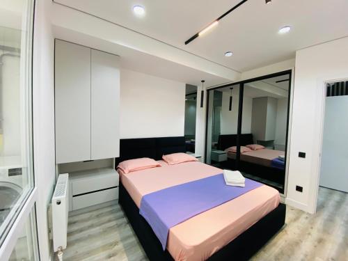 Ένα ή περισσότερα κρεβάτια σε δωμάτιο στο Apartament Relax Chișinău
