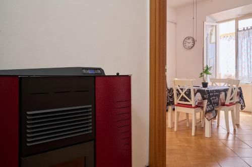 a living room with a table and a dining room at Casabaffo in Piombino