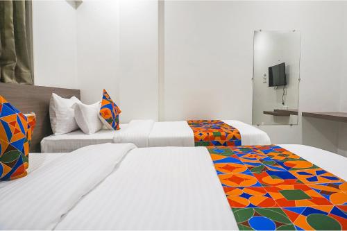 Postel nebo postele na pokoji v ubytování FabHotel Prime Athiti Delight Stay