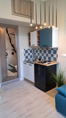 a kitchen with a sink and a counter top at Bamboo deluxe in Limenas
