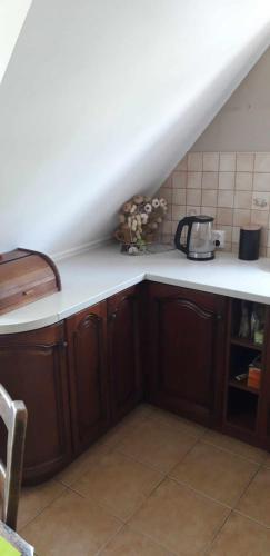 a kitchen with a white counter top in a room at Zajazd Stok in Górecko Stare
