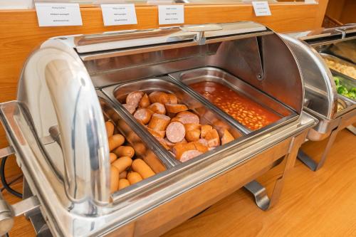 a display case of food in a bakery at City Centre in Prague