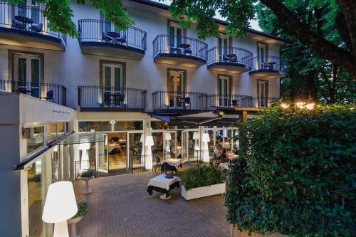 a building with blue balconies on the side of it at Boutique Hotel Calzavecchio in Casalecchio di Reno