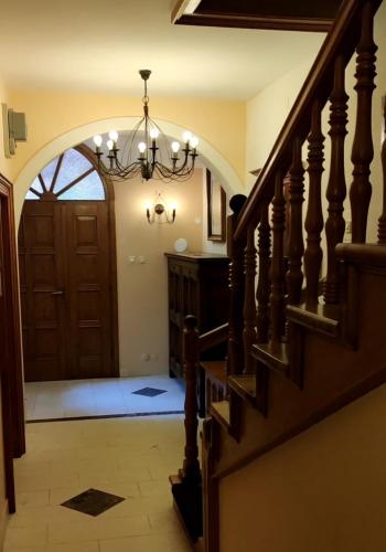 a hallway with a door and a chandelier at Old House - Ferienhaus in Selce