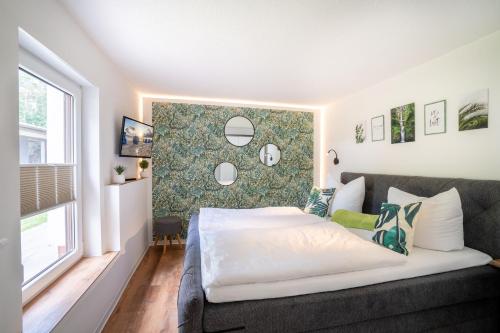 Postel nebo postele na pokoji v ubytování Gerhart-Hauptmann-Strasse 1a Ferienhaus Gartenidylle