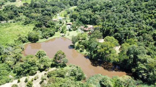 an aerial view of a river with trees at Pousada Fazenda Bocaina in Inhaúma