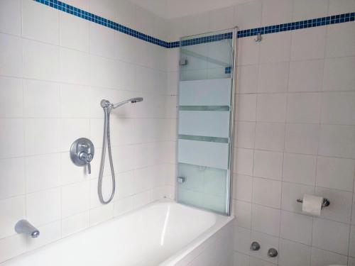 a bathroom with a shower with a bath tub at La casa di Cri al mare due in Borgio Verezzi